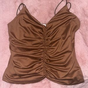 Size xs brown top runs big tho on straps
